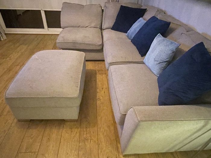 Large grey L shaped sofa & matching footstool