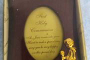 wooden photo frame commemorative plaque for a First Holy Communion. The plaque features an oval-shaped insert with a message and a small golden figure of a child praying.