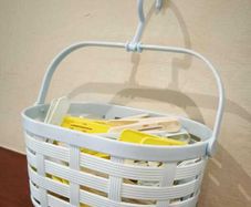Clothes peg basket with pegs