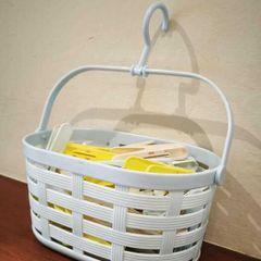 Clothes peg basket with pegs
