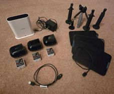 Arlo Pro 4 three cameras, a base station, solar panels