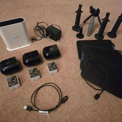 Arlo Pro 4 three cameras, a base station, solar panels