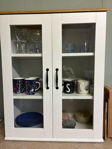 White cabinet with glass doors