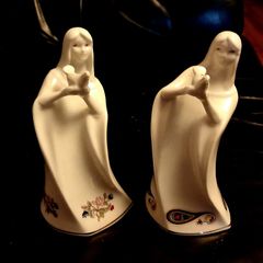 Two Royal Tara Ladies Holding a Bird