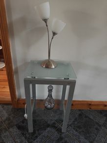 table with table lamp and vase