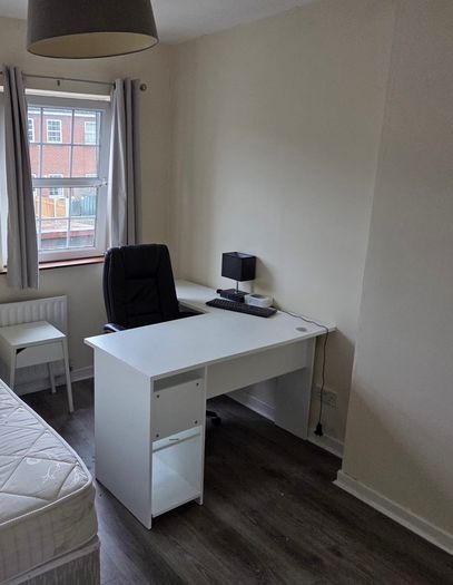 White corner desk with shelving