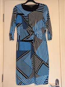 Stunning unique design midi dress with rouched front detail.