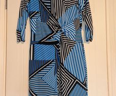 Stunning unique design midi dress with rouched front detail.
