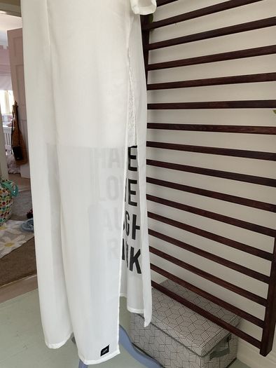 long tunic with side slits Bnwt.  Short sleeve white with black logo