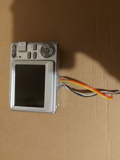 Z880 Digital Camera, Takes 2AA Batteries, working fine, has a modification that doesn't affect its performance