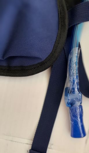 new navy hydrational bag pack tag attached