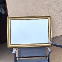 Old gold framed bevelled mirror
