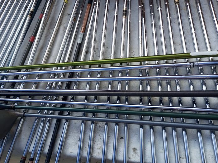 A selection of golf clubs and bags. All right handed clubs.