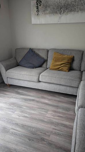 Gray fabric corner chase sofa with footstool