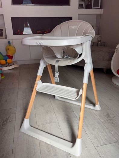 Mash high chair with changeable baby seat.