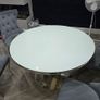 White round glass table with four chairs Image 2