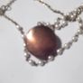 a vintage locket  penden on a long chain with pearls and white stones Image 4