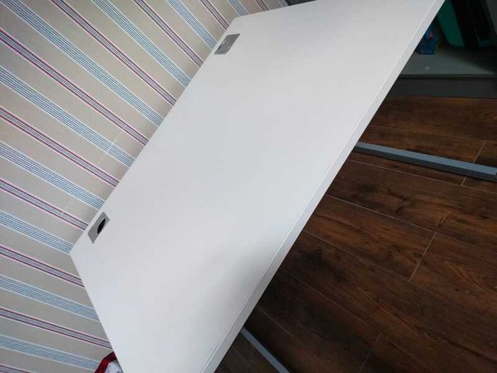 Modern white office desk with grey metal frame