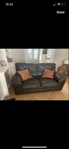 Two seater dark leather sofa