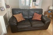 Two seater dark leather sofa