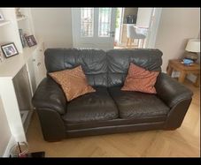 Two seater dark leather sofa