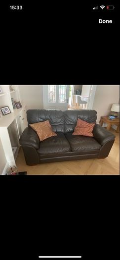 Two seater dark leather sofa