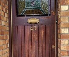 Teak front door with stained glass panel. Frame not available.