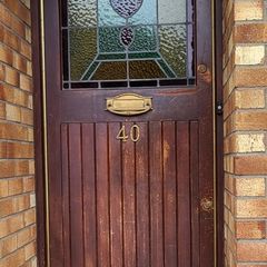 Teak front door with stained glass panel
