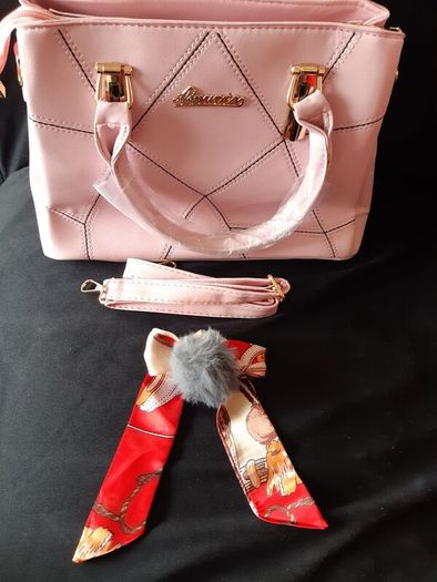 Bottle of Perfume and New Handbag
