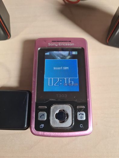 Sony Ericsson T303 pink mobile phone and speakers MPS-60