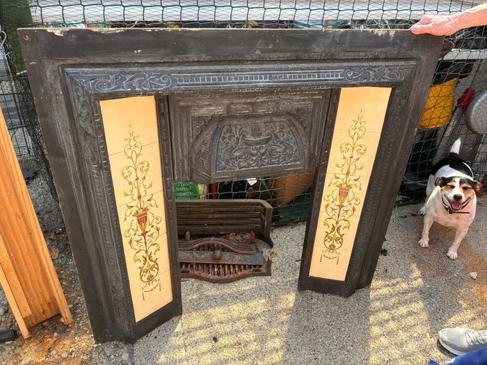 Antique Victorian fireplace with a modern pine mantle