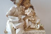 Boy and girl on bench Figurine