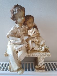 Boy and girl on bench Figurine