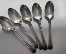 Old set of 5 nickel plated silver spoons