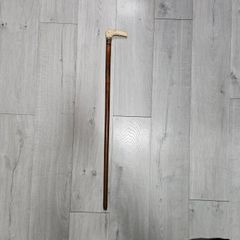 antique wooden cane or walking stick