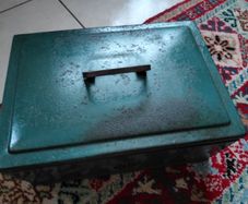 Vintage green metal cash box with key