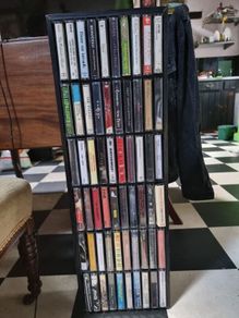 60 cassette tapes and cassette rack