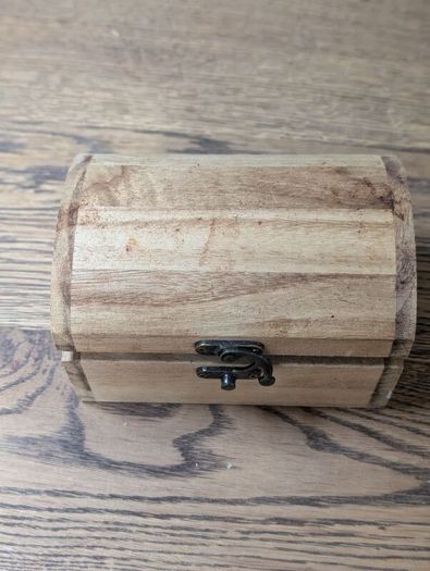 Wooden box with vials and paperbags
