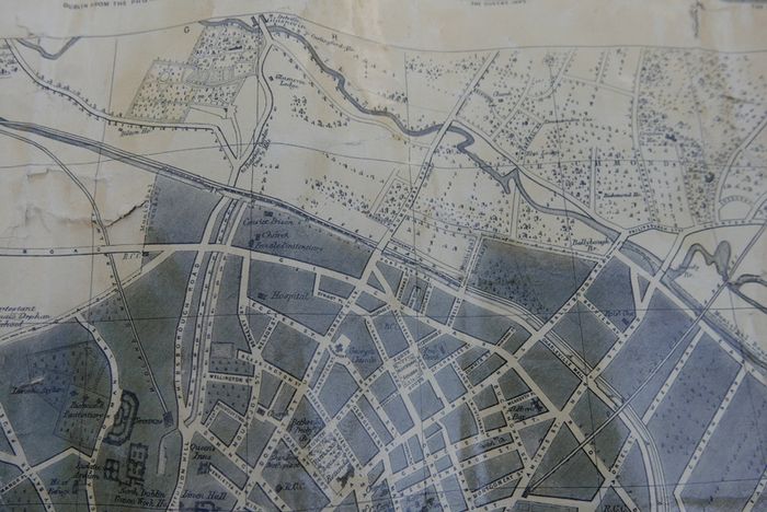 Antique DUBLIN. Map of Dublin & Suburbs with 22 vignettes of Dublin landmarks. Published by Edward Heffernan, 1st June, 1868, 12 Charleville Road, Rathmines. 28" x 22,5". Linen backed. Frayed at edges