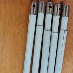 Five white extendable net curtain rods