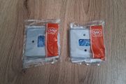 Two MK Grid 1-Module Switch Grid Faceplate Grey