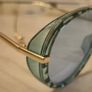 Aviator sunglasses with blue lenses and gold-tone arms Image 4