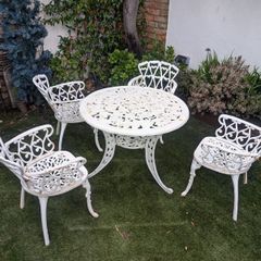 Ornate cast iron garden table and 4chairs
