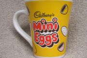 CADBURYS MINI EGGS - an Easter promotional mug featuring the 'Mr. Cadburys Parrot' mascot