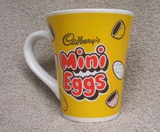 CADBURYS MINI EGGS - an Easter promotional mug featuring the 'Mr. Cadburys Parrot' mascot