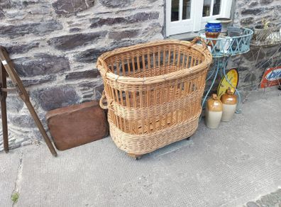 large wicker Laundry / Bakery Basket on wheels 34" long