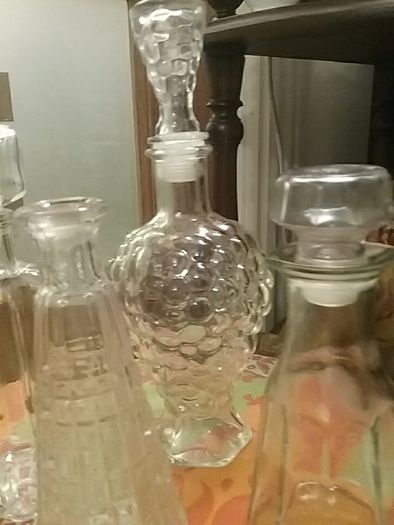 Four Glass Decanters with Stoppers