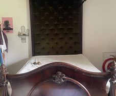 Antique wooden half-tester bed