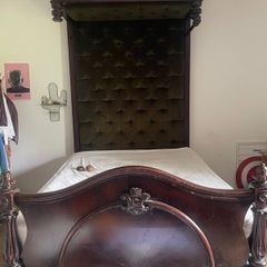 Antique wooden half-tester bed