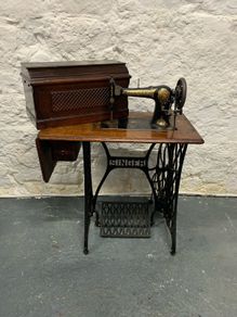 Vintage Singer Cast Iron Sewing Table with Jones 6400 Machine.